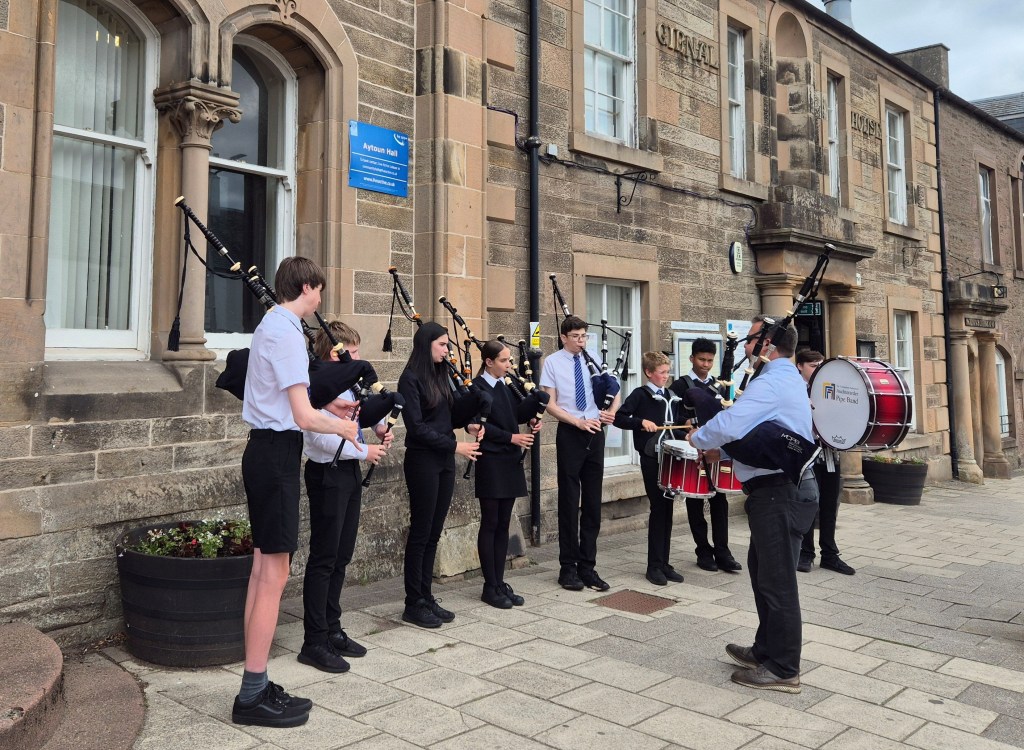 Pipe band in local town high street